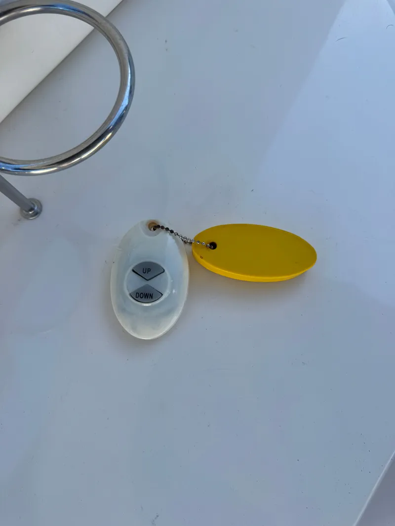 Slide: The Image of Remote with yellow tag on Sea Ray 290 Bowrider, 2002. - 38