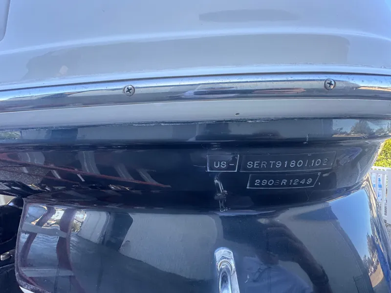 Slide: The Image of Rear view of a 2002 Sea Ray 290 Bowrider boat. - 4