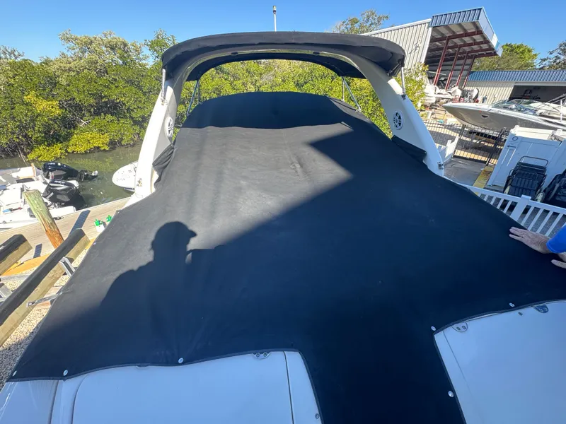 Slide: The Image of Covered Sea Ray 290 Bowrider boat, 2002 model, docked at marina. - 40