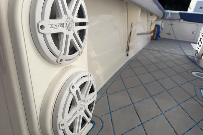 Slide: The Image of 2004 Jupiter 31 Cuddy boat interior with JL Audio speakers and stylish flooring. - 37