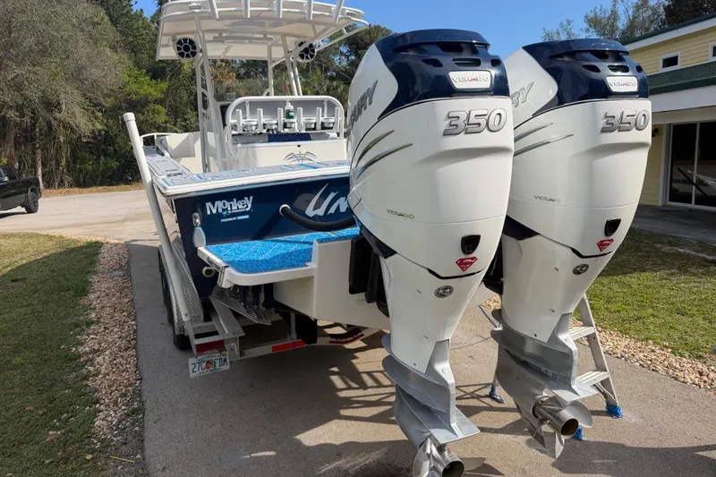 Slide: The Image of 2004 Jupiter 31 Cuddy boat with twin Mercury 350 Verado engines on a trailer. - 9