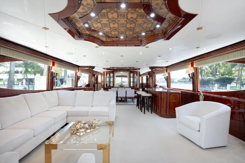 Slide: The Image of Luxurious interior of 2004 Lazzara LY106 yacht with elegant seating and wooden accents. - 11