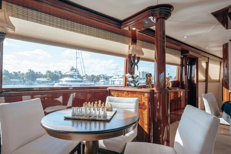 Slide: The Image of Luxurious interior of 2004 Lazzara LY106 yacht with elegant wood finishes and chess set. - 17