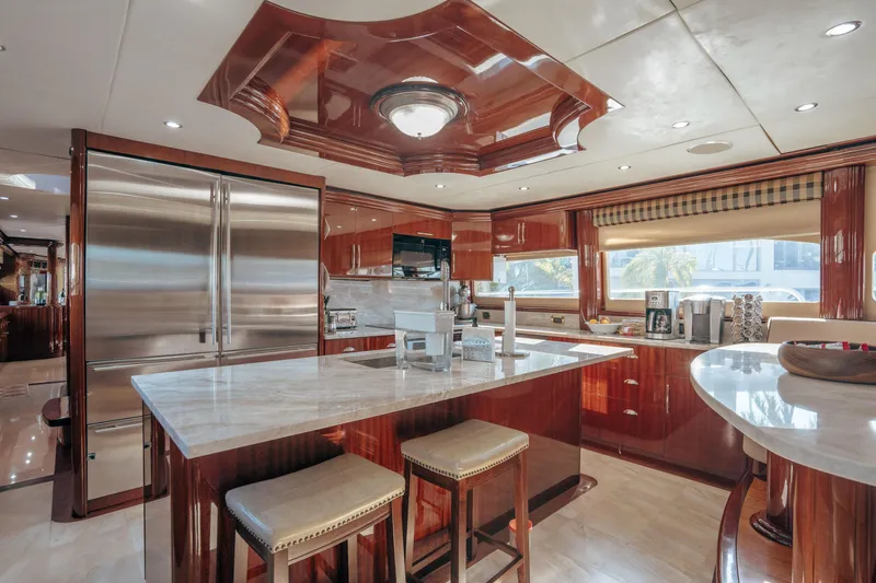 Slide: The Image of Luxurious kitchen interior of 2004 Lazzara LY106 yacht with marble countertops and wooden cabinetry. - 20