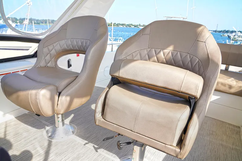 Slide: The Image of Luxury seating on 2020 Carver C40 yacht, featuring elegant design and waterfront view. - 10