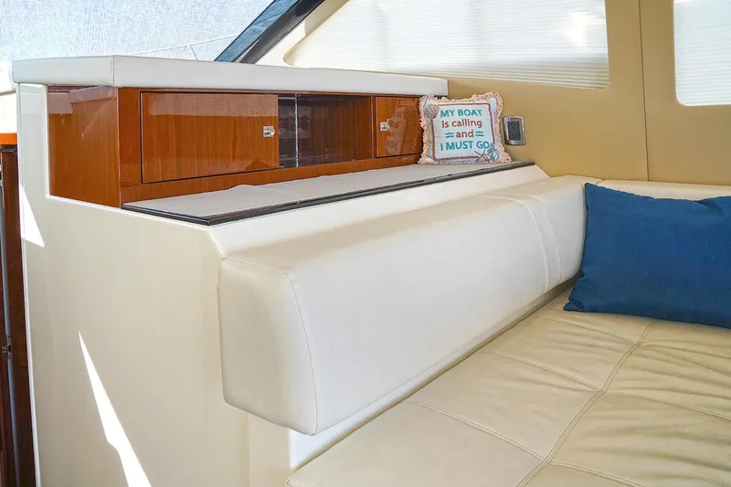 Slide: The Image of Interior of 2020 Carver C40 yacht with beige seating and decorative sign. - 19