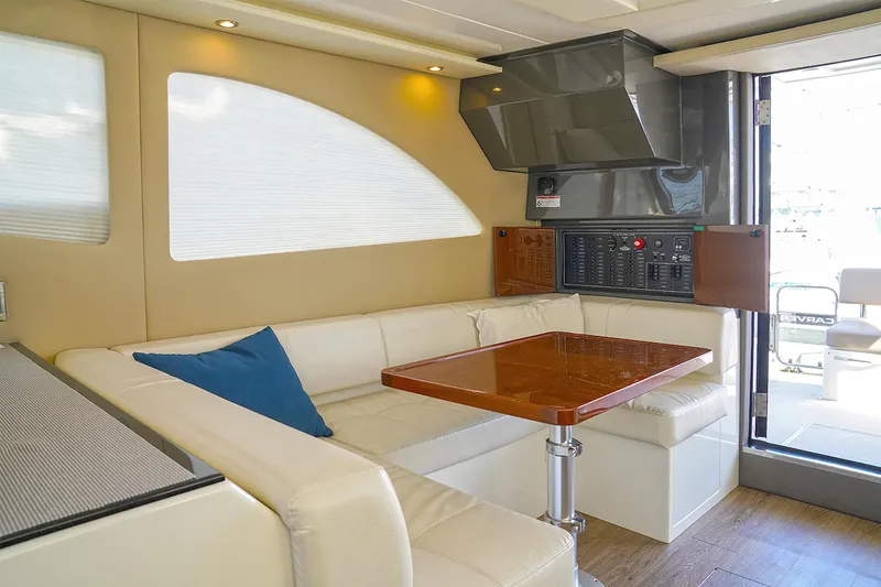 Slide: The Image of Luxurious interior of 2020 Carver C40 yacht with elegant seating and wooden table. - 21
