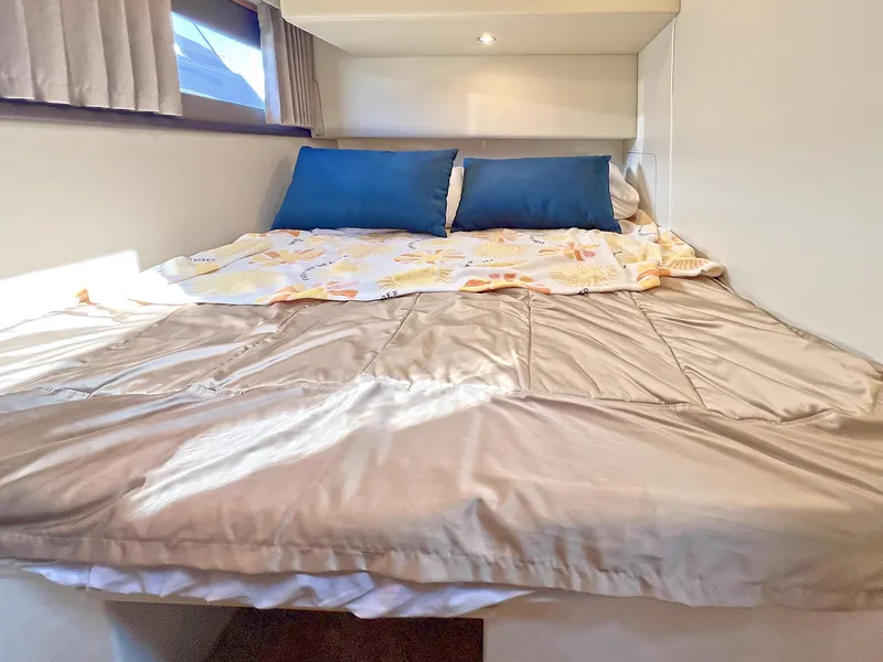 Slide: The Image of Cozy bedroom in 2020 Carver C40 yacht with double bed and blue pillows. - 23