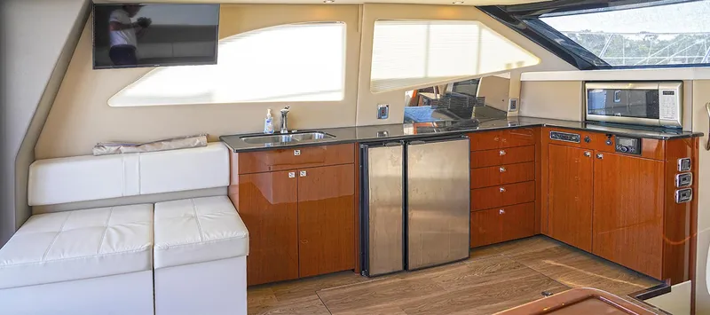 Slide: The Image of Interior of 2020 Carver C40 yacht with modern kitchen and seating area. - 16