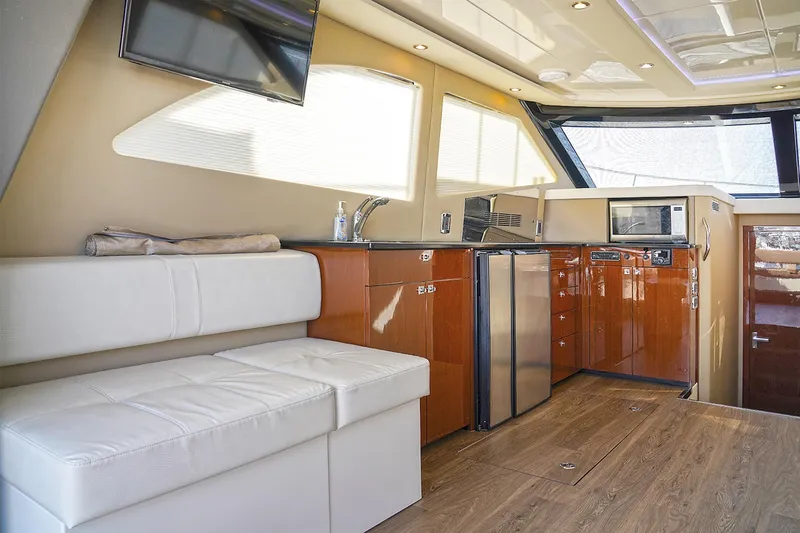 Slide: The Image of Luxurious interior of 2020 Carver C40 yacht with modern kitchen and seating area. - 22