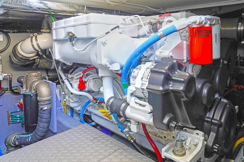 Slide: The Image of Engine compartment of 2020 Carver C40, showcasing detailed mechanical components and vibrant wiring. - 28