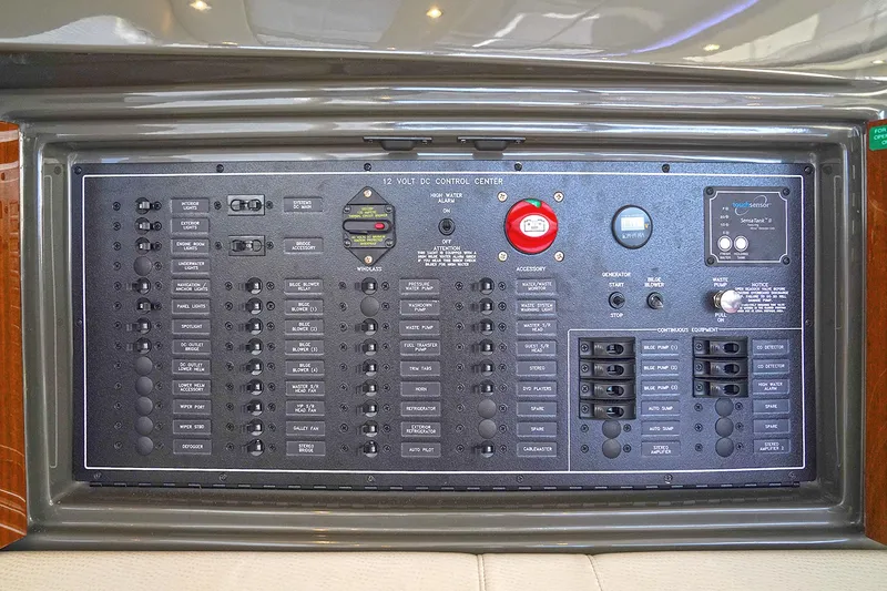 Slide: The Image of Electrical control panel of a 2020 Carver C40 yacht, featuring various switches and indicators. - 30