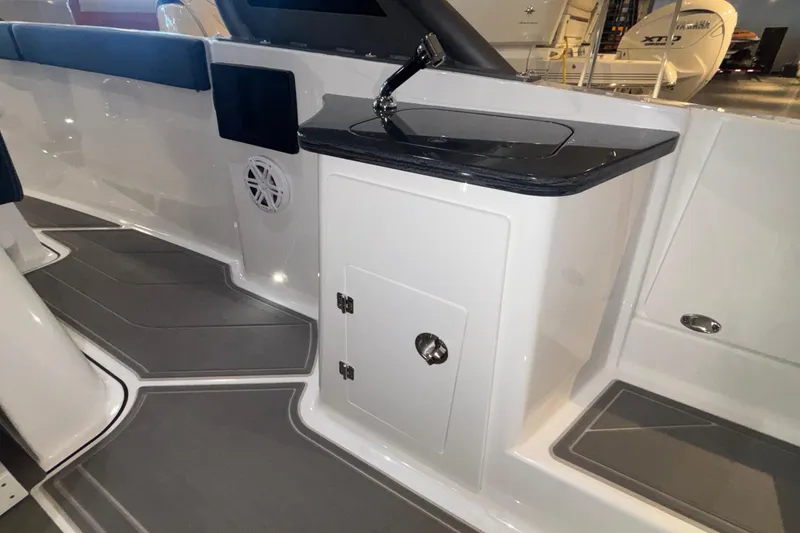 Slide: The Image of 2026 Monterey Elite 27 OB boat interior with sleek design and modern amenities. - 13
