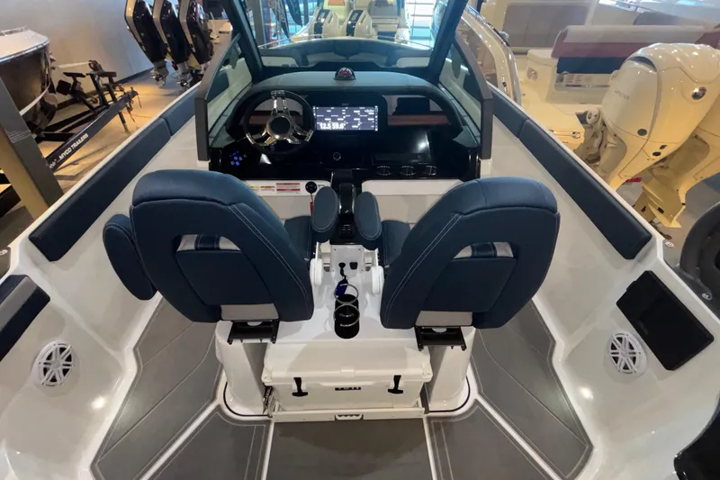 Slide: The Image of 2026 Monterey Elite 27 OB boat interior with dual seats and modern dashboard. - 14