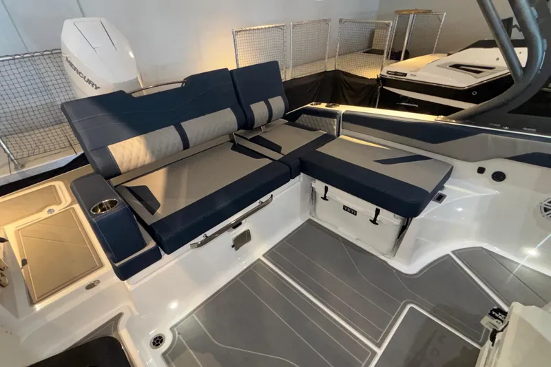 Slide: The Image of 2026 Monterey Elite 27 OB boat interior with cushioned seating and modern design. - 16