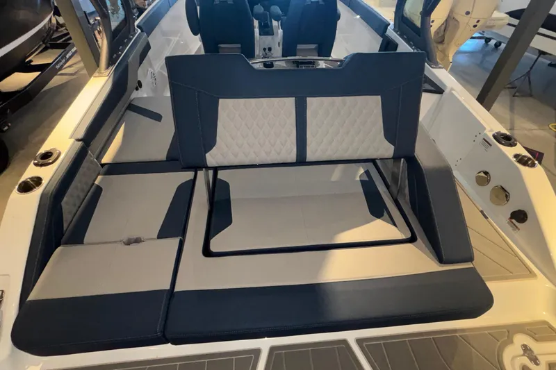Slide: The Image of 2026 Monterey Elite 27 OB boat interior with luxurious seating and modern design. - 18