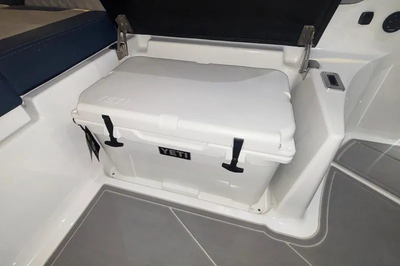 Slide: The Image of YETI cooler on 2026 Monterey Elite 27 OB boat, open storage compartment. - 20