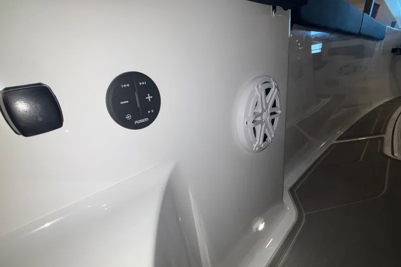 Slide: The Image of 2026 Monterey Elite 27 OB boat interior with audio controls and speaker system. - 22