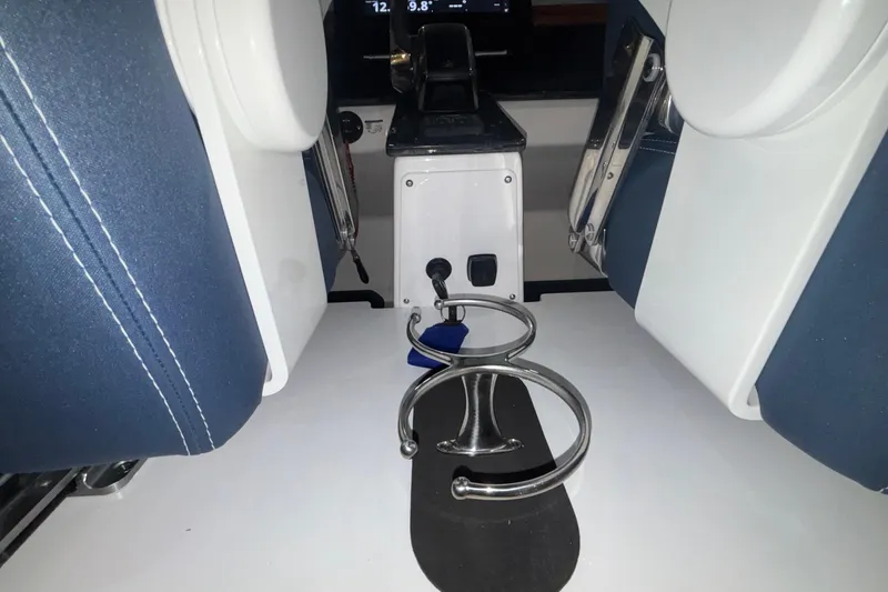 Slide: The Image of Interior of 2026 Monterey Elite 27 OB boat with cup holders and seating. - 26