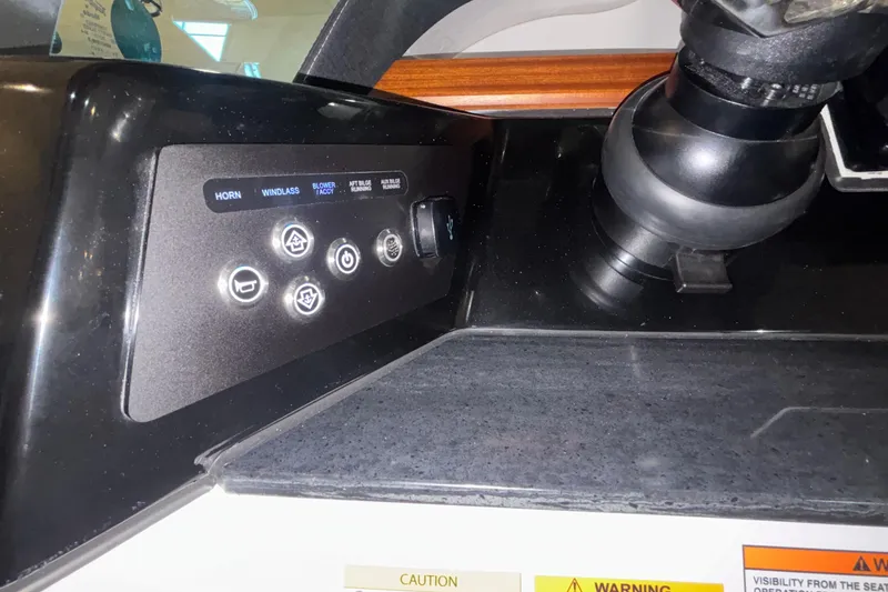 Slide: The Image of Control panel of 2026 Monterey Elite 27 OB boat with various function buttons. - 28