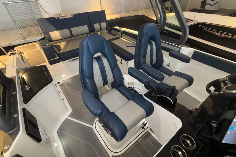 Slide: The Image of 2026 Monterey Elite 27 OB boat interior with luxurious seating and modern design. - 46