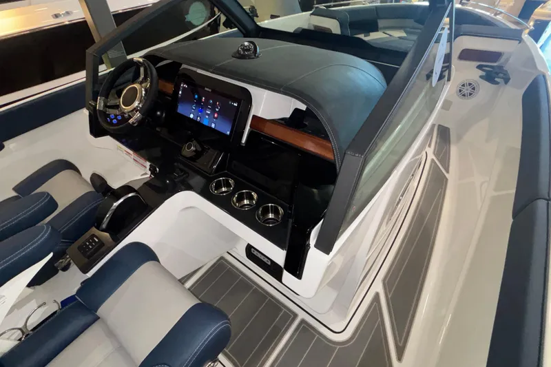 Slide: The Image of 2026 Monterey Elite 27 OB boat interior with modern dashboard and seating. - 47