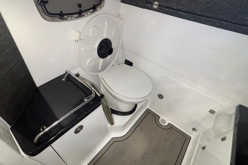 Slide: The Image of 2026 Monterey Elite 27 OB boat bathroom with modern fixtures and sleek design. - 54