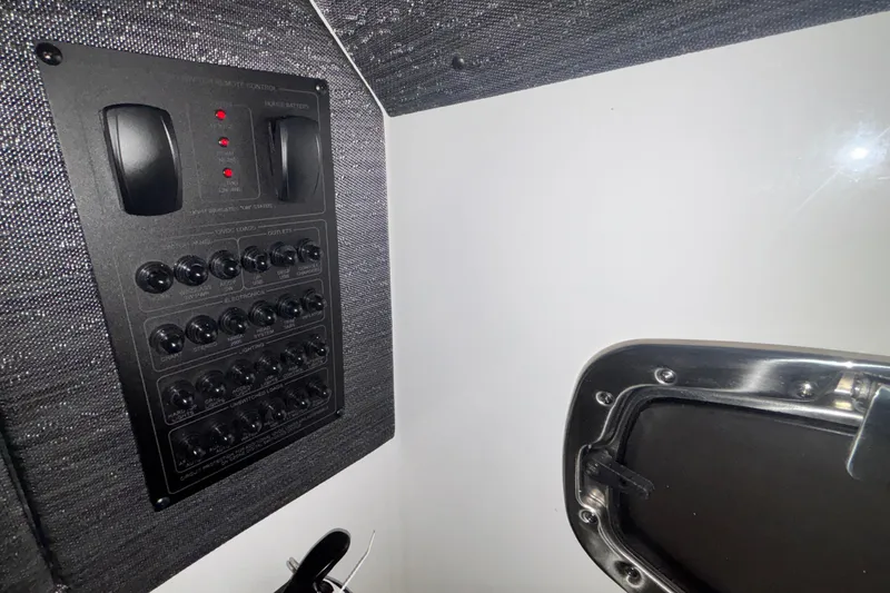 Slide: The Image of Control panel and hatch inside 2026 Monterey Elite 27 OB boat. - 60
