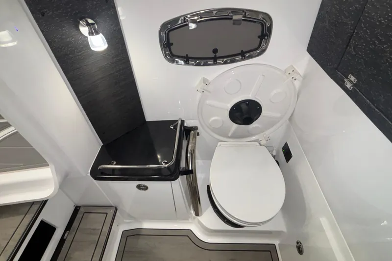 Slide: The Image of 2026 Monterey Elite 27 OB boat bathroom with modern fixtures and compact design. - 63