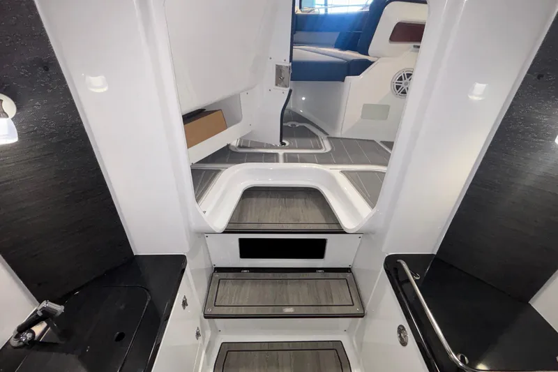 Slide: The Image of 2026 Monterey Elite 27 OB boat interior with sleek design and modern amenities. - 64