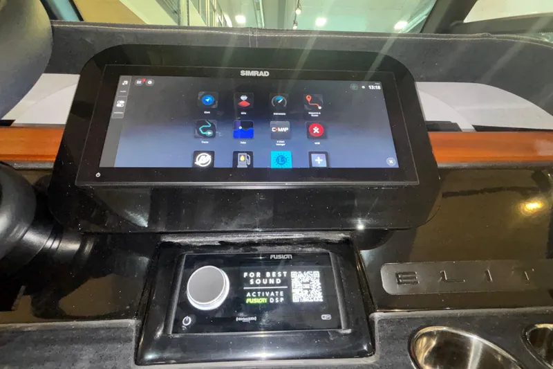 Slide: The Image of Dashboard of 2026 Monterey Elite 27 OB with Simrad and Fusion displays. - 66