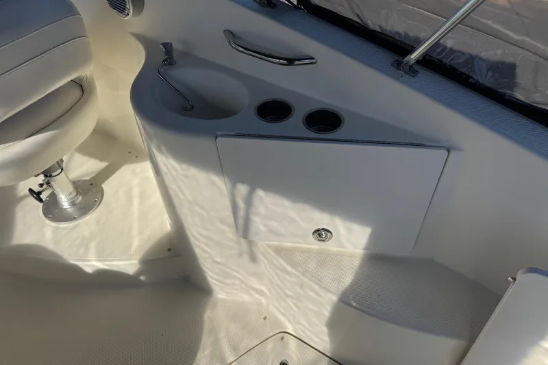 Slide: The Image of 2009 Bayliner 265 SB boat interior with seating and cup holders. - 15