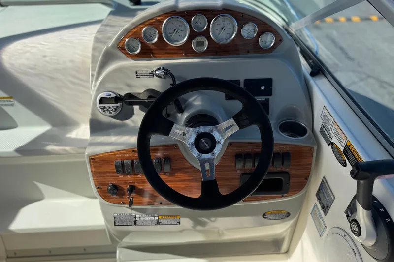 Slide: The Image of 2009 Bayliner 265 SB boat dashboard with steering wheel and instrument panel. - 20