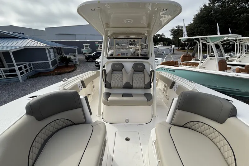 Slide: The Image of 2026 Key West 263 FS boat interior with cushioned seating and modern design. - 11