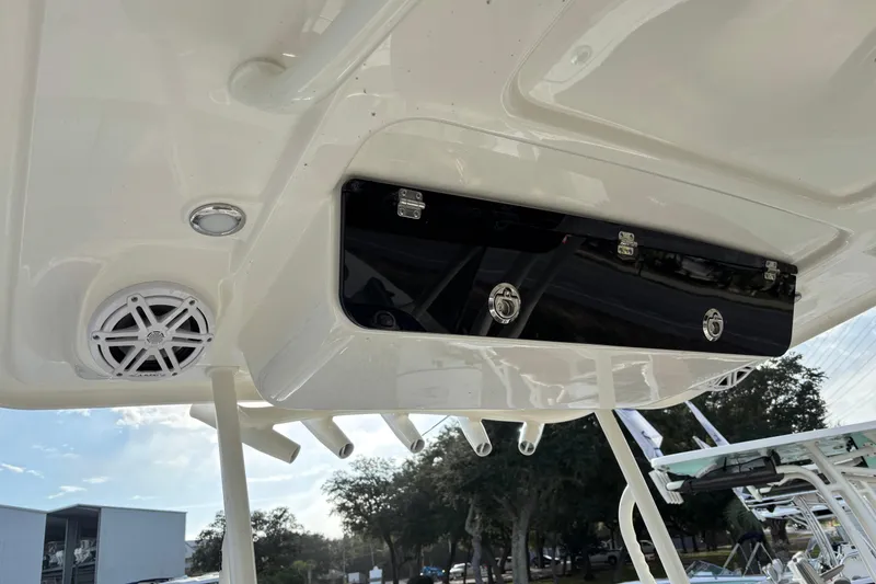 Slide: The Image of 2026 Key West 263 FS boat interior with speaker and storage compartment. - 19