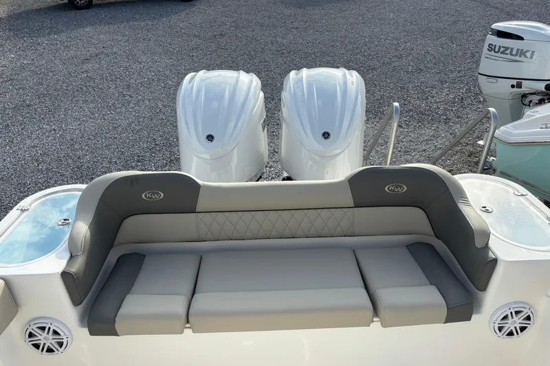 Slide: The Image of 2026 Key West 263 FS boat with dual engines and cushioned seating. - 25