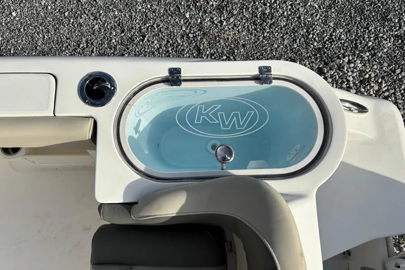 Slide: The Image of Livewell on 2026 Key West 263 FS boat, featuring KW logo and seating. - 26