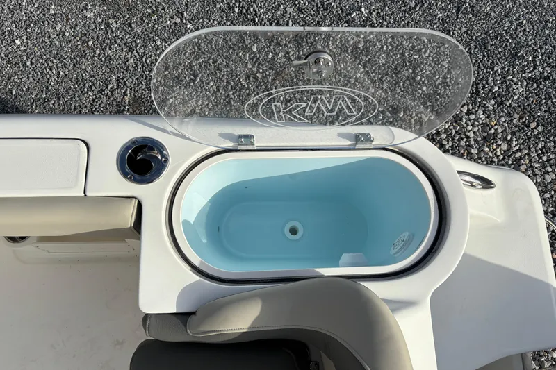 Slide: The Image of Livewell on 2026 Key West 263 FS boat, open lid, blue interior. - 27