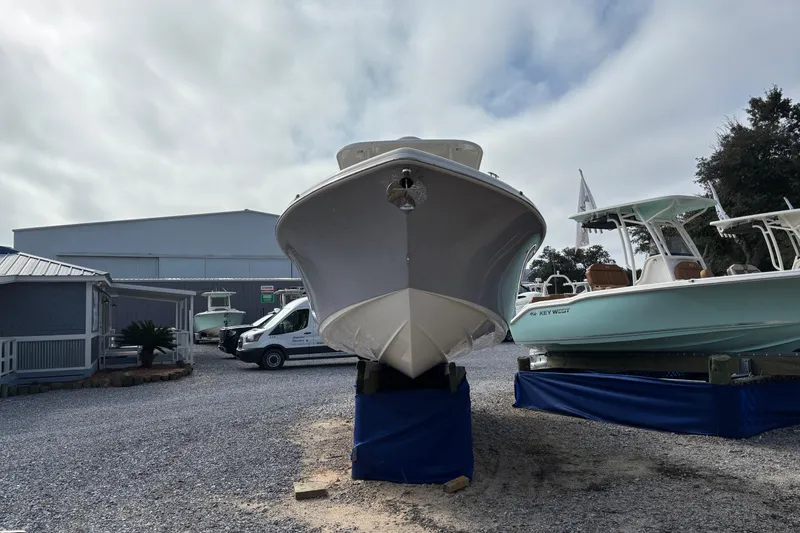 Slide: The Image of 2026 Key West 263 FS boat displayed outdoors on a gravel lot. - 3