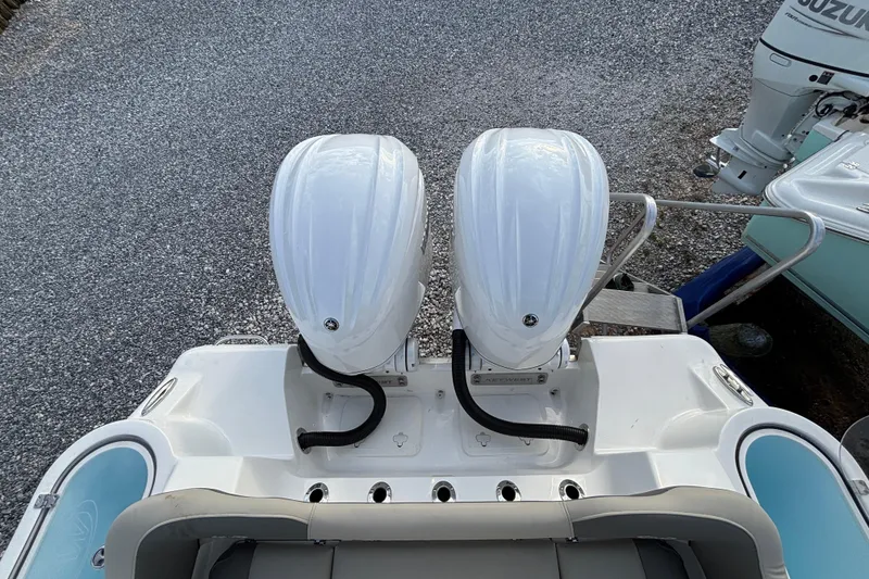 Slide: The Image of 2026 Key West 263 FS boat with dual outboard engines, viewed from above. - 30