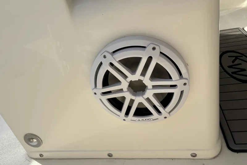 Slide: The Image of White JL Audio speaker on 2026 Key West 263 FS boat interior. - 32