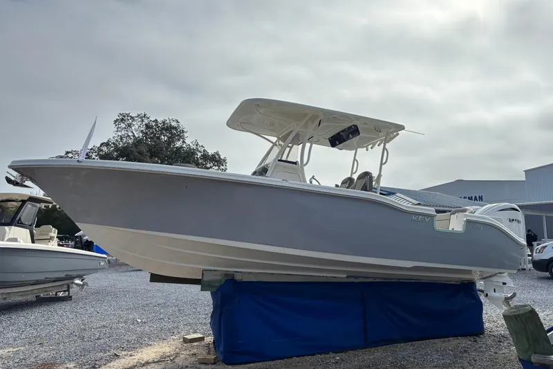 Slide: The Image of 2026 Key West 263 FS boat displayed outdoors on a stand. - 4