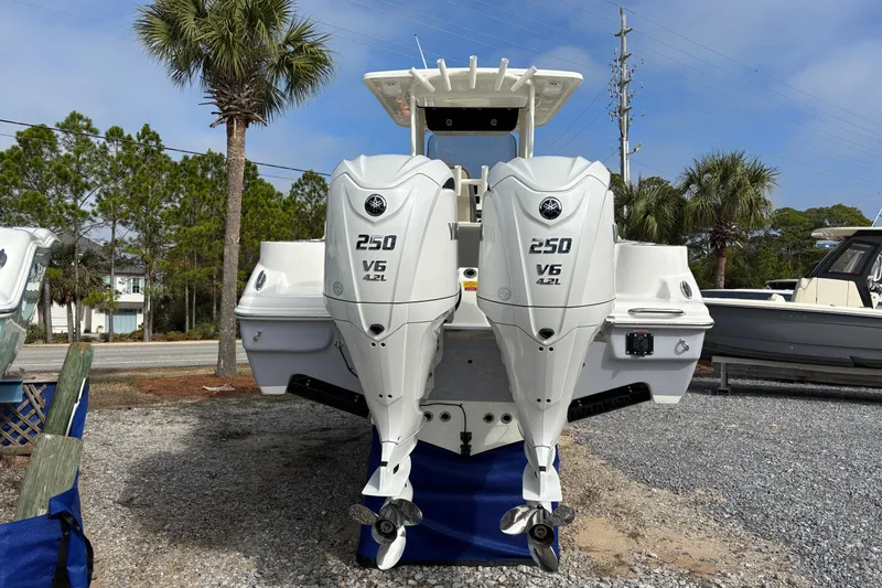 Slide: The Image of 2026 Key West 263 FS boat with twin Yamaha 250 V6 engines, parked outdoors. - 7