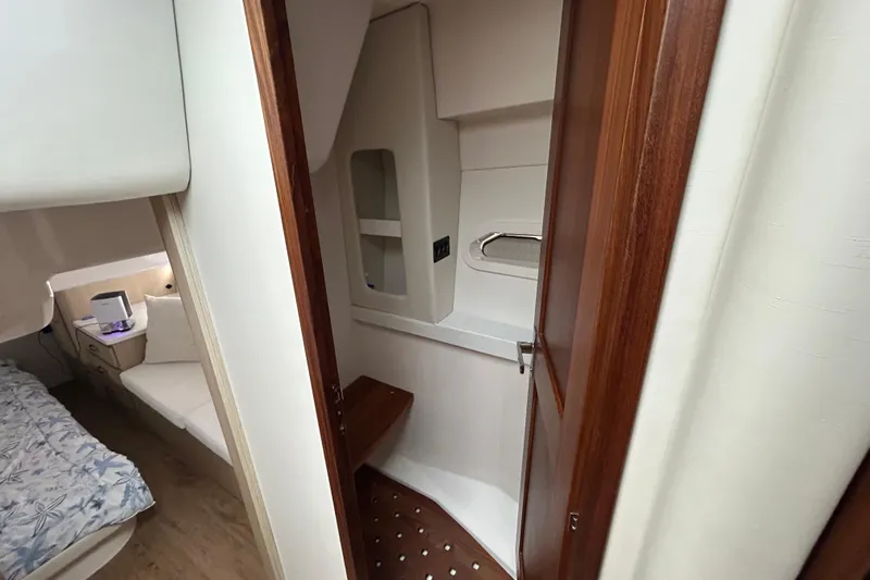 Slide: The Image of Interior of 2023 Regal 38 FXO yacht featuring a cozy cabin and modern bathroom. - 100