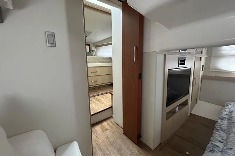 Slide: The Image of Interior of 2023 Regal 38 FXO yacht featuring a cozy cabin and modern amenities. - 103