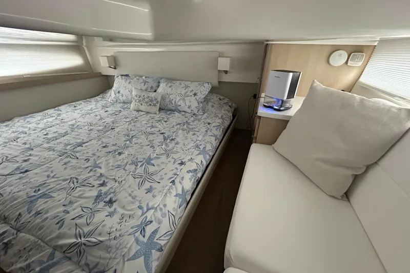 Slide: The Image of Luxurious bedroom interior of 2023 Regal 38 FXO yacht with floral bedding. - 106