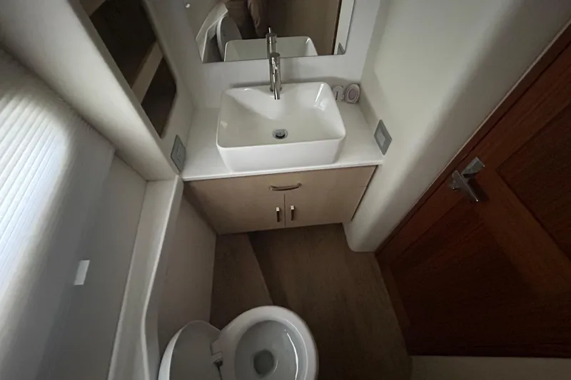 Slide: The Image of Modern bathroom interior of 2023 Regal 38 FXO yacht with sink and toilet. - 120