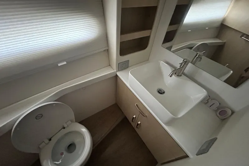 Slide: The Image of Luxurious bathroom in 2023 Regal 38 FXO yacht with modern sink and toilet. - 121