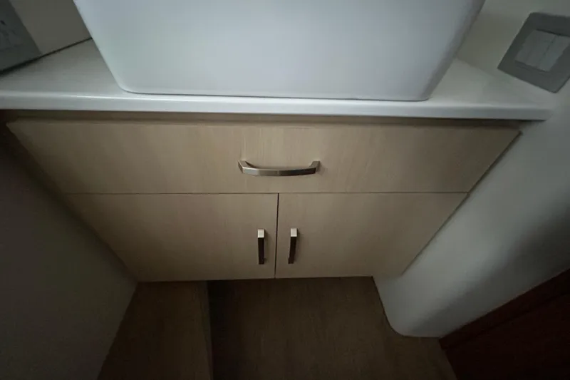 Slide: The Image of Modern bathroom cabinet in 2023 Regal 38 FXO yacht, featuring sleek design and storage. - 122