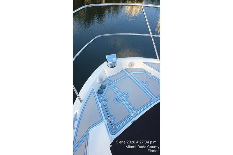 Slide: The Image of 2023 Regal 38 FXO yacht deck with railing, docked in Miami-Dade County, Florida. - 19
